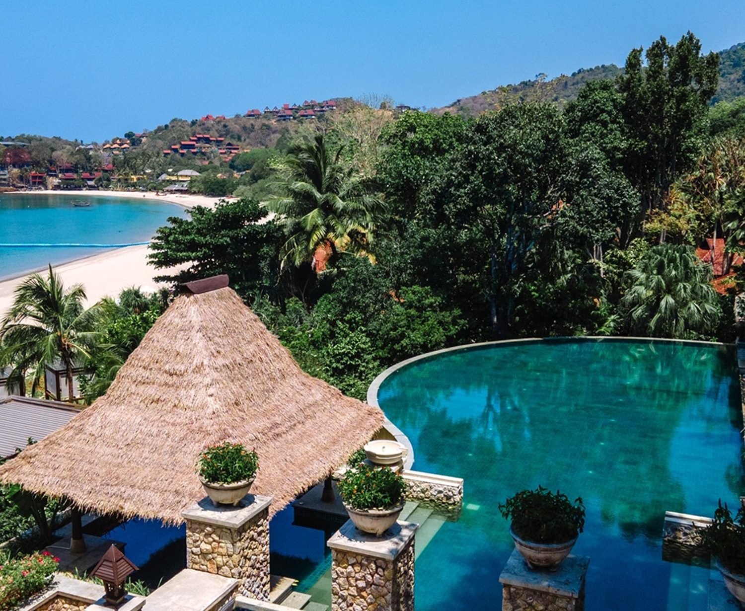 Infinity pool beside a thatched pavilion — Pimalai Resort & Spa