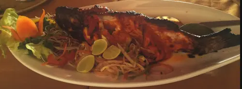 Grilled red snapper, feet in the sand, at Sairee