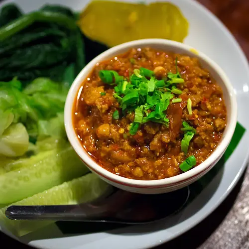 Nam Prik Ong with tomatoes and fresh herbs