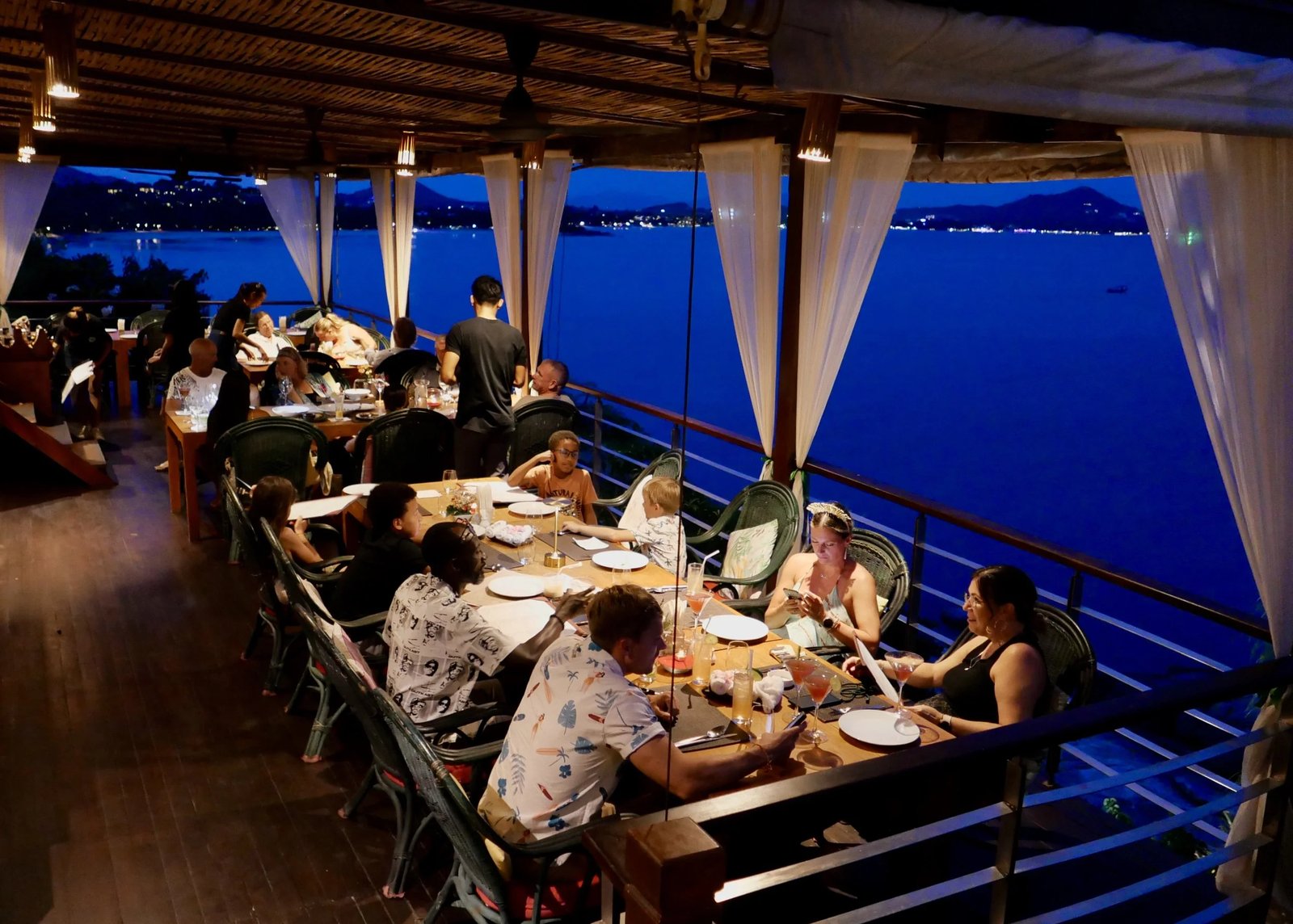 Dinner on the terrace at nightfall — Dr Frogs Bar & Grill