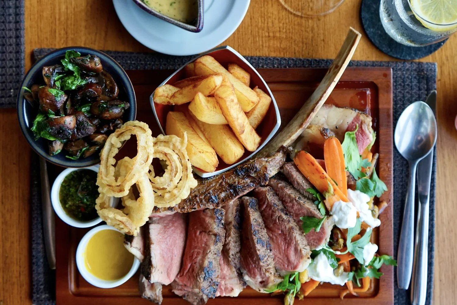 A grill platter with onion rings and steak fries — Dr Frogs Bar & Grill