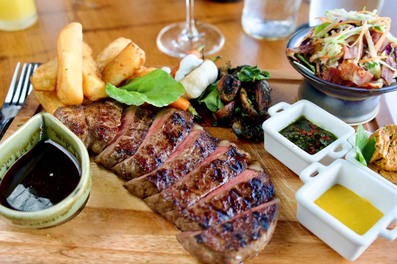 Sliced steak with its sauces — Dr Frogs Bar & Grill